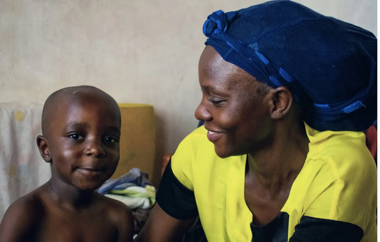 A mother smiling at her young child
