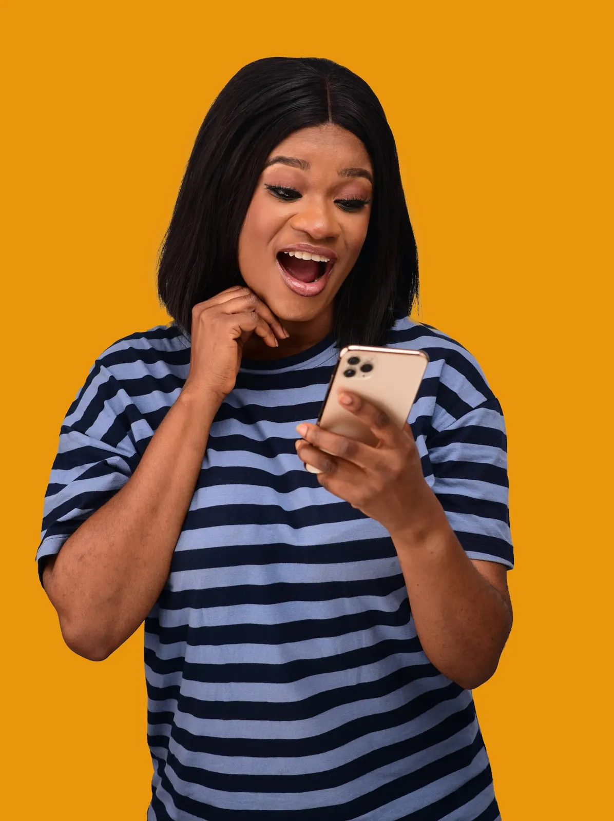 A woman looking at her phone in surprise