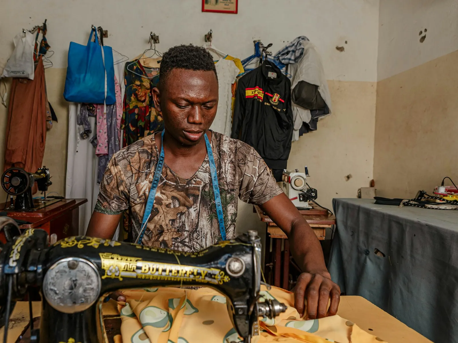 A tailor at his sewing machine